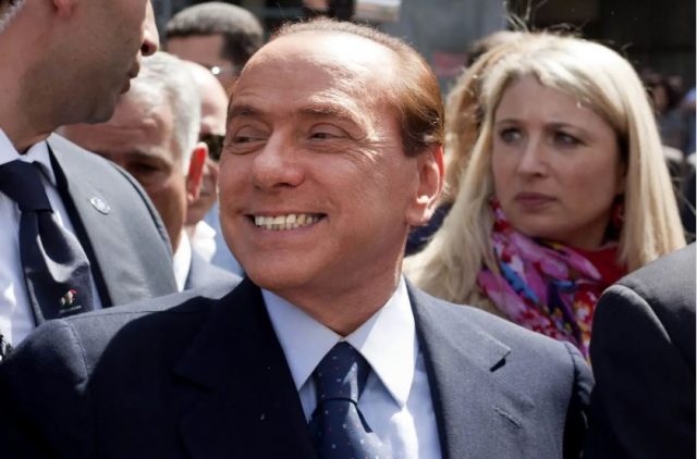 MILAN, ITALY – APRIL 11: Italian Prime Minister Silvio Berlusconi speaks outside the Palazzo Di Giustizia after a legal hearing to face tax fraud charges related to his media businesses, Mediaset on April 11, 2011 in Milan, Italy. Berlusconi has denied charges that his media empire had purchased TV and film rights through various offshore companies and falsely declared prices to reduce its tax bill. (Photo by Massimo Di Nonno/Getty Images)